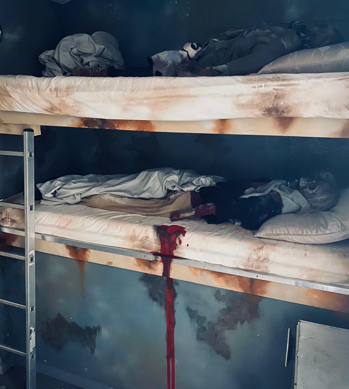 interior of escape game Panic Room with dummy sceletons